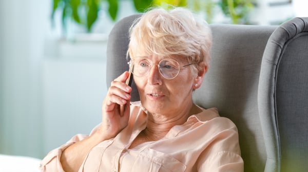 Old woman talking on mobile phone