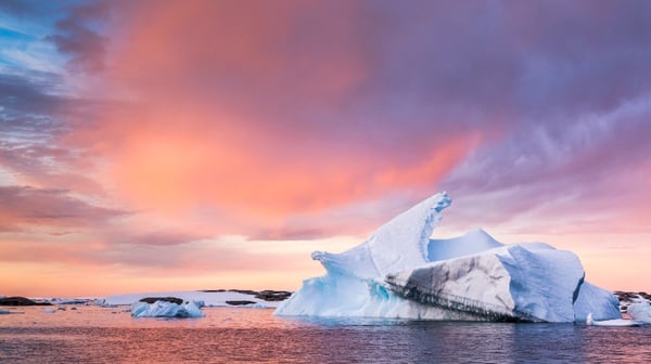 Sun setting over an iceberg